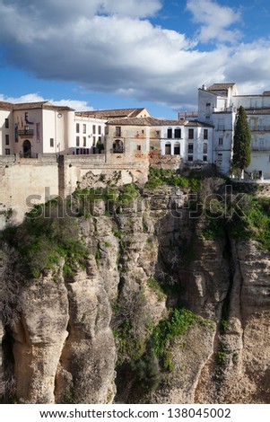 View of buildings in new town from other side of the 18th century bridge over the 300 ft Tajo Gorge in Ronda Spain