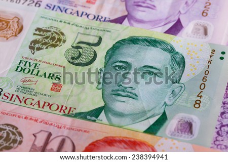Different Singapore Dollar banknotes on the table