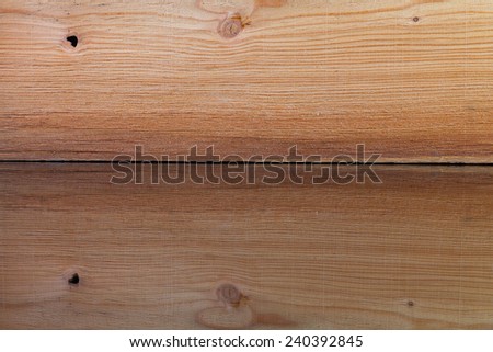 Realistic wood veneer with interesting growth rings on the glass desk