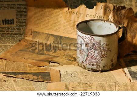 tea cup and old newspaper