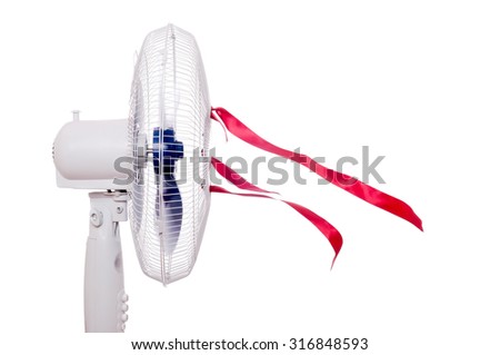 Working air fan with red ribbons isolated on white. Air movement using blower or ventilator at home