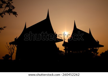 Silhouette picture of Thai Houses with sunset