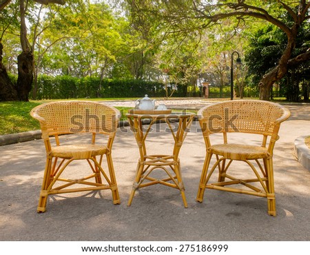 Wooden Rattan Chairs with Set of Tea on Table for Afternoon Tea
