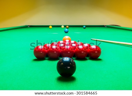 Opening Frame of Snooker Game with Cue from Back