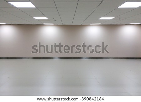 Perspective view of Empty Space of Classic White Office Room with Row of Ceiling Light Lamp and Lights Shade on The Wall for Gallery Interior or Used as Template to Mock Up or Display Office Furniture