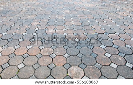 Perspective View of Various Color Grunge Brick Stone on The Ground for Street Road. Sidewalk, Driveway, Pavers, Pavement in Vintage Design Flooring Hexagon Pattern Texture Background