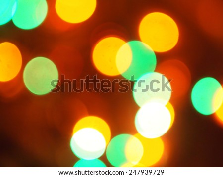 abstract red background blue, white, yellow and red lights bokeh circles / out of focus