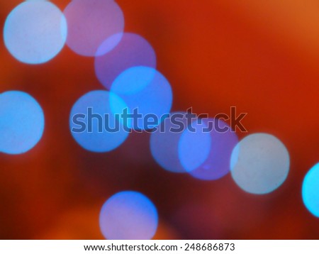 abstract blue and red background, blue lights bokeh circles / out of focus
