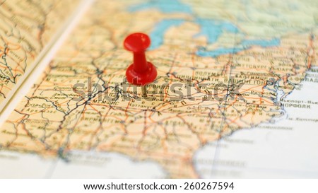 point on map concept: Nashville pinned on the old Soviet map / partially out of focus, focus point on pushpin area