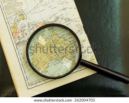 Moscow, Russia - March 11, 2015: old Russian Map of Australia under the magnifying glass.