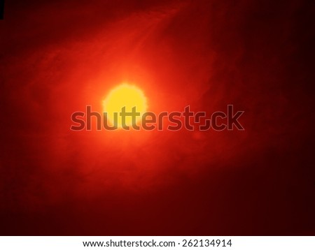 Eclipse mystical background / real image of a solar eclipse shot in Russia, Moscow, March 20, 2015, only the red filter processing