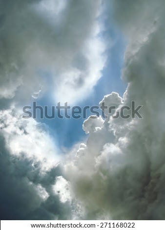 Keepers of heaven. Figures from the clouds in the sky, a natural mystical background.