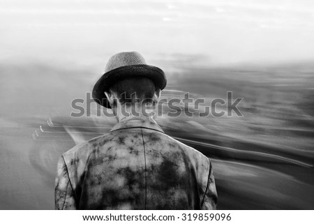 lonely strange man on blurred background, black and white image