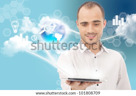 Businessman holding business world using tablet computer