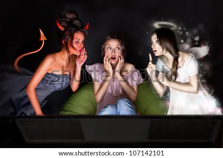 Portrait of pretty woman sitting at home. Angel and devil talking to her from different sides of picture. She is hesitating about decision