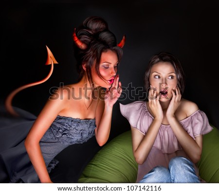 Young woman sitting at home and seductive devil coming to her and giving a bad suggestion