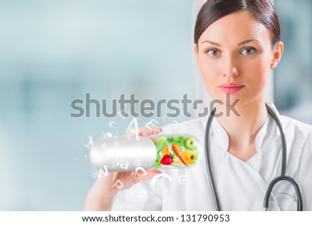 Healthy Life Concept. Female Medical Doctor Holding Vitamins