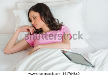 Young beautiful woman sleeping on the bed and dreams