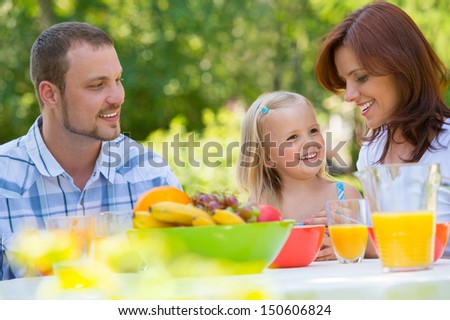 Family on picnic at park or backyard