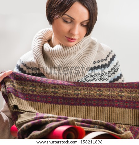 Portrait of a woman preparing to her husband or boyfriend surprise with a gift on his birthday or christmas or valentine\'s day or another holiday