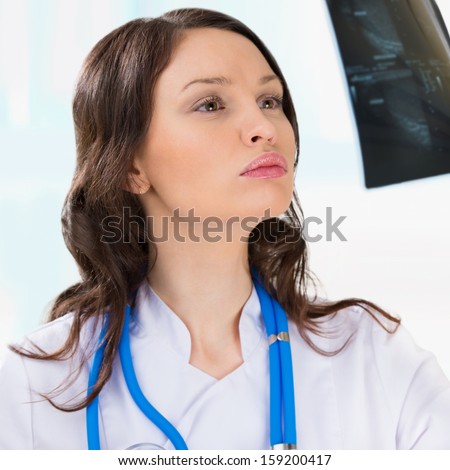 Female doctor looking at a testicles ultrasound results