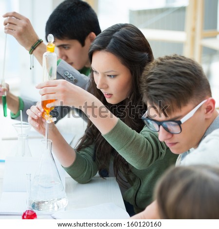 High School students. Group of students working together at laboratory class.