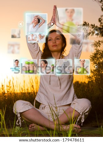 Sporty woman outdoors working out using modern virtual interface. Online fitness trainer concept