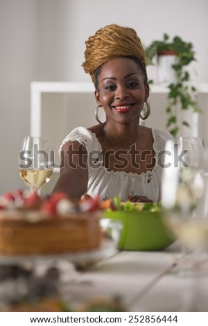 Closeup Of Beautiful African American Woman Eating Healthy Food and Drinking Wine At Home
