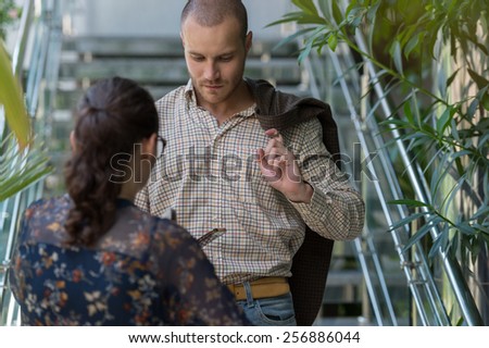 Businessman meeting his colleague on stairs at office building