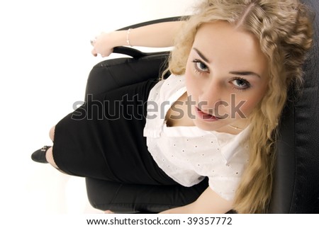 Young woman: sexy casual posing with armchair
