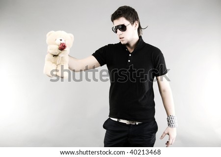 Young man: posing with teddy bear