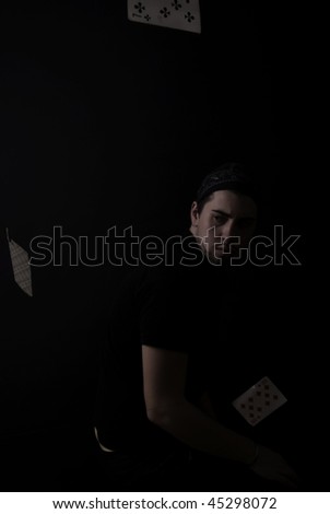 Portrait of a cool guy: posing with cards
