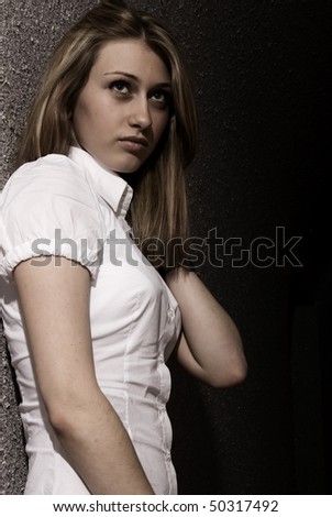 Young woman near wall  portrait
