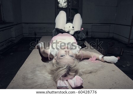 Young sexy trash woman inside empty room posing