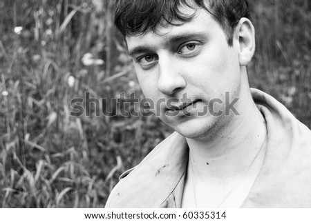 Portrait of adult man with sad look and ironic smile