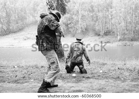 Dramatic scene of fight between soldiers black and white photo