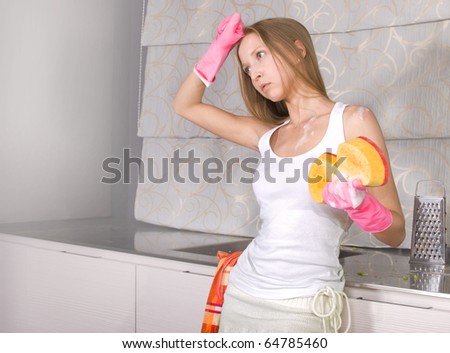 Portrait of young tired woman cooking at kitchen and need help
