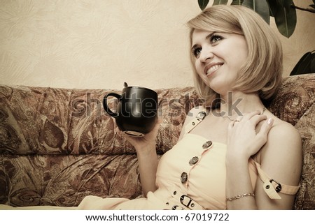 Young beautiful lady drinking coffee