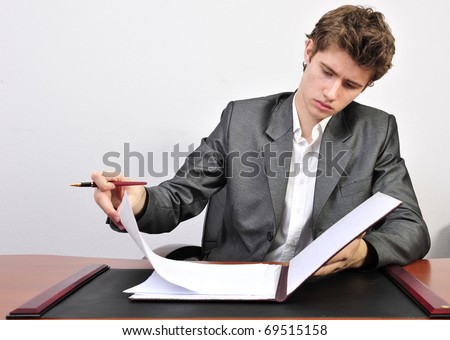 Business man working with documents in his office. Approving loan concept