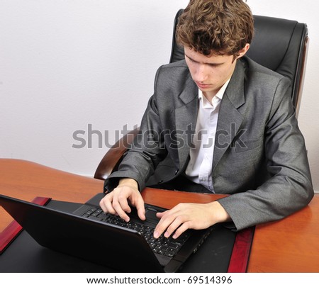 Business man working on computer at his office