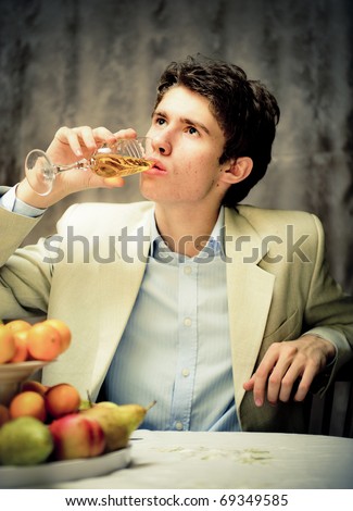 http://image.shutterstock.com/display_pic_with_logo/282061/282061,1294627956,1/stock-photo-portrait-of-young-rich-man-sitting-alone-in-his-apartment-drinking-champagne-and-eating-fresh-fruits-69349585.jpg