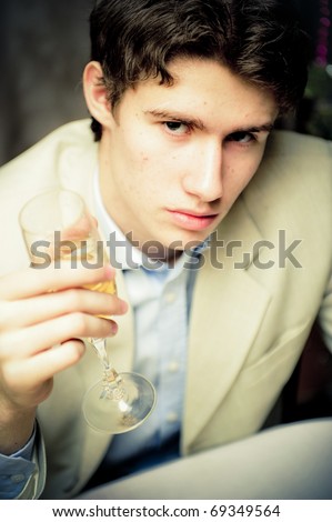 http://image.shutterstock.com/display_pic_with_logo/282061/282061,1294627981,1/stock-photo-portrait-of-young-rich-man-sitting-alone-in-his-apartment-drinking-champagne-and-eating-fresh-fruits-69349564.jpg