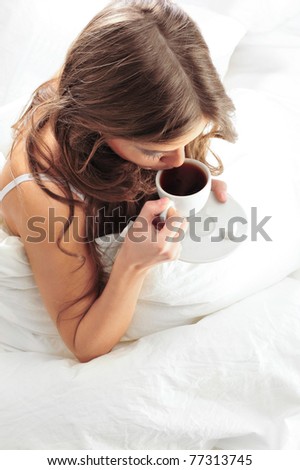 stock photo Fashion portrait of young elegant woman in bed at she s 