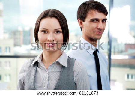 Two contemporary business people ready for a meeting
