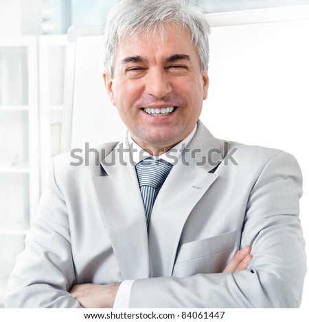 Portrait of an older businessman. Office background.