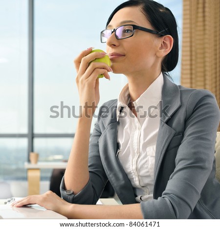 Portrait of a beautiful young businesswoman thinking. Office background.