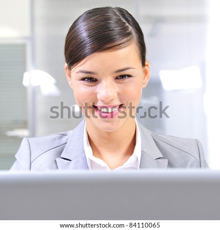 Beautiful business woman thinking about something while working no computer at her office