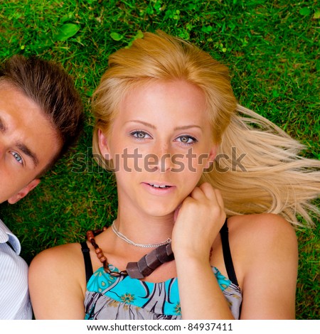 For every single pretty girl is tending her boyfriend. A portrait of a sweet couple in love. Photo from above. Square.