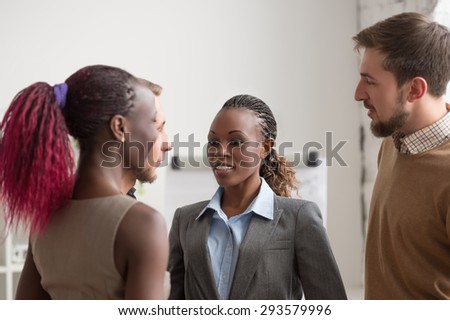 Business people talking at office. Multiracial group of people