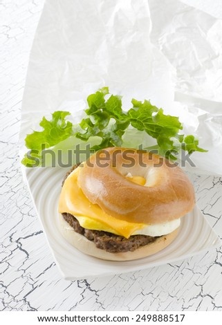 Bagel with Angus beef, egg, cheese and lettuce.